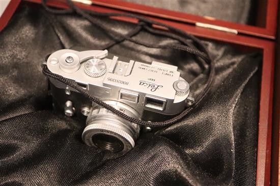 A cased Minox Leica miniature camera, a Minox glass, Contax 1 and a Minox Classic Leica III (3)
